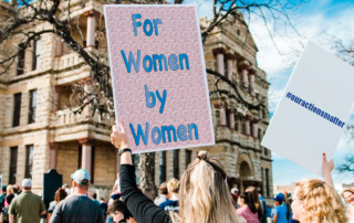 Activists with signs